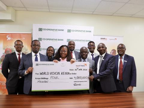 Photo 3 COOP Bank Director Lydiah Rono and World Vision Kenya ND are joined by other executives from both organisations following a partnership agreement